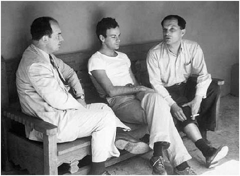 Black and white photo: von Neumann, Feynman, and Ulam on the porch of Bandelier lodge in Frijoles Canyon, New Mexico, during a picnic, ca 1949 (Nicholas Metropolis)